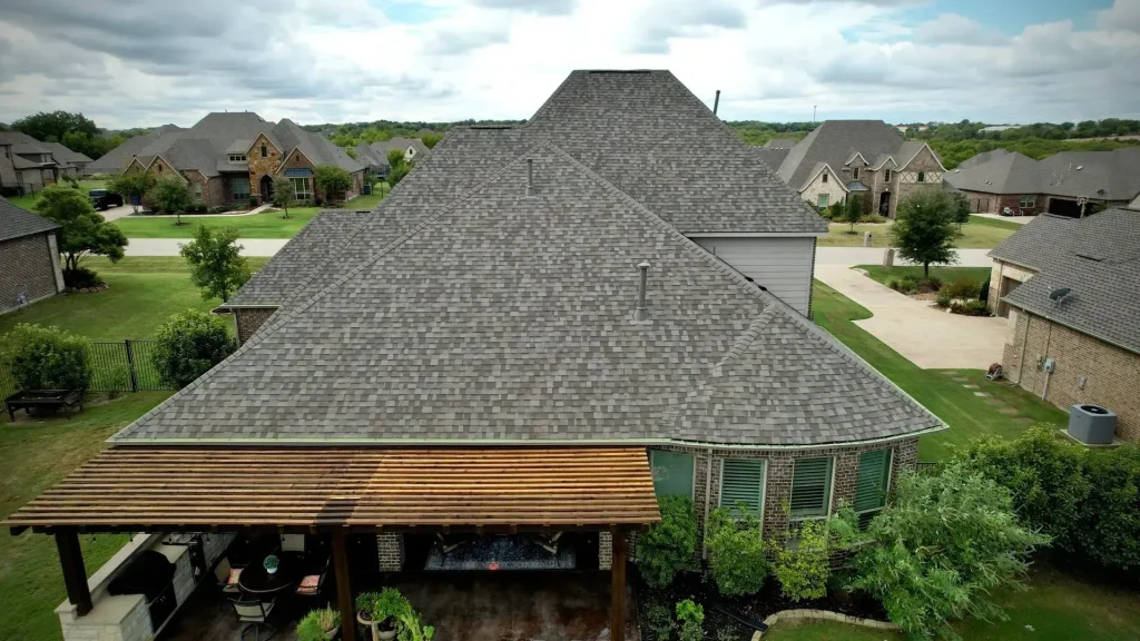 Close-up aerial view of a new gray shingle roof in Rockwall, TX