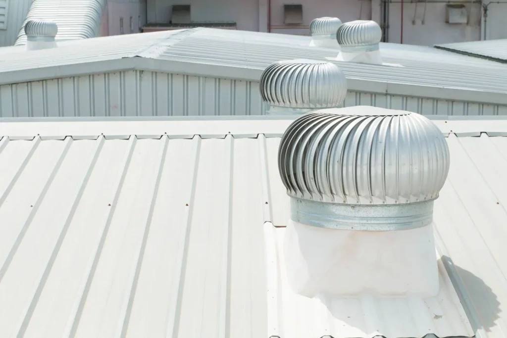 Commercial metal roof with turbine vent in Rockwall, TX
